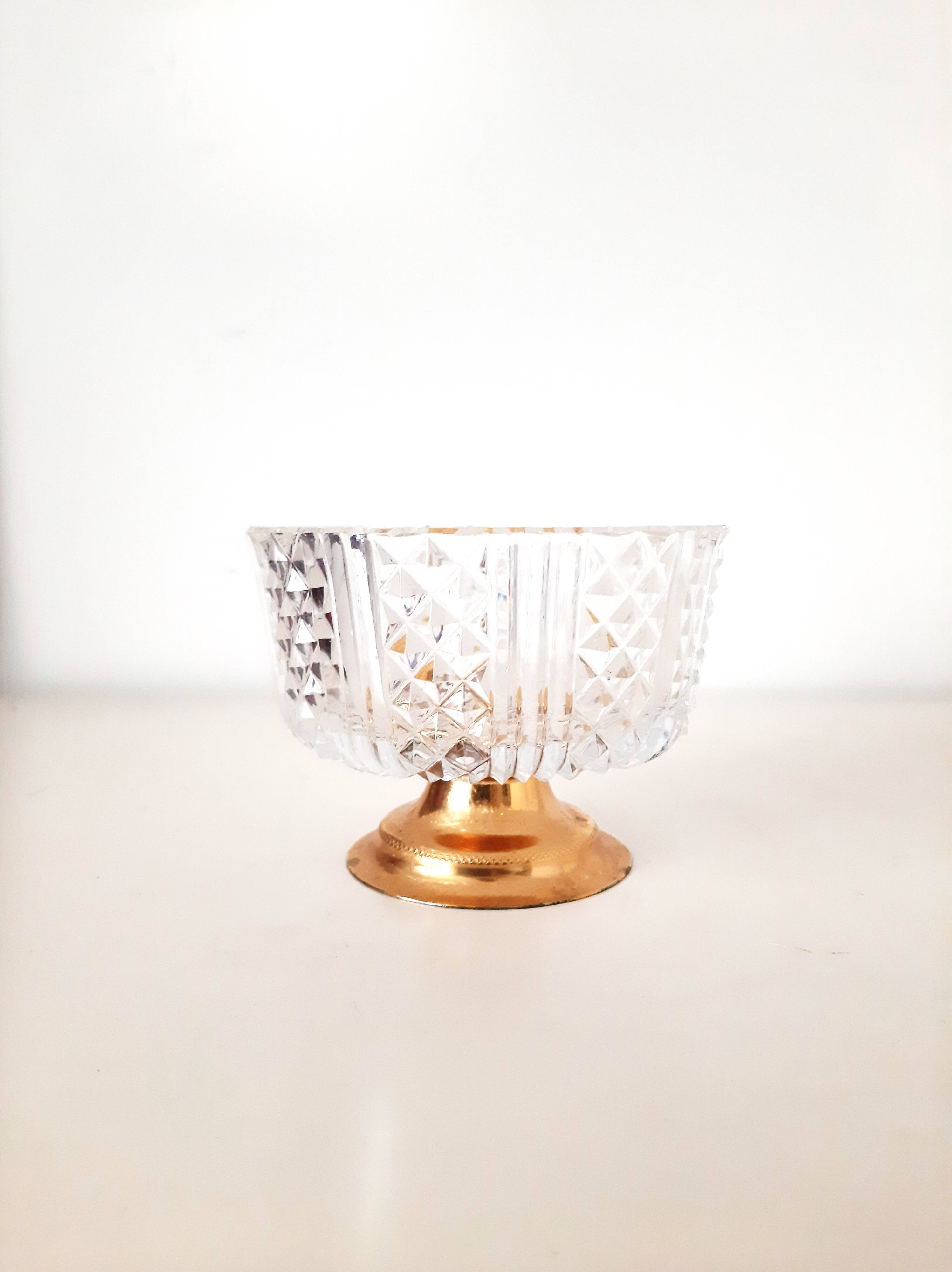 Chiseled crystal bowl with gilded metal base