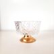 Chiseled crystal bowl with gilded metal base