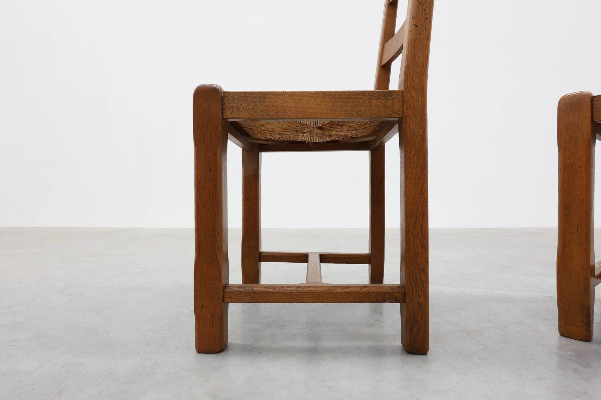 Set of 6 rustic oak ladder-back chairs with rush seats, France, 20th centur