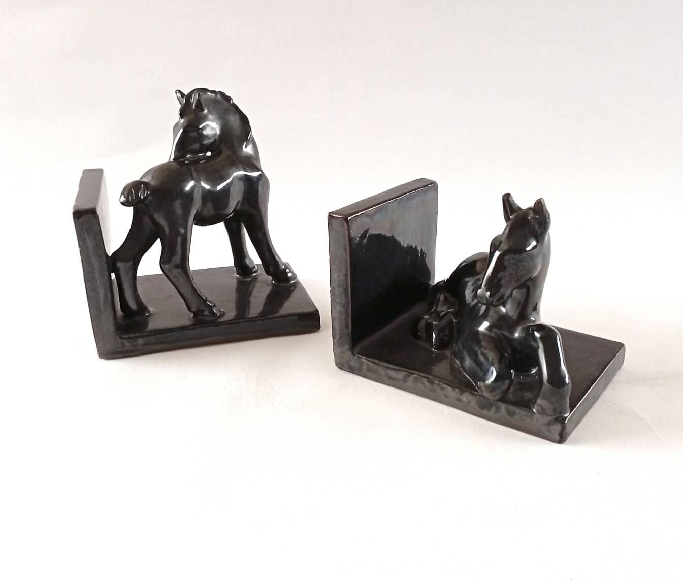 Black ceramic bookends horses