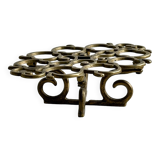 Brass trivet with openwork pattern in the shape of apples.