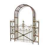 Garden arch with a wrought iron gate