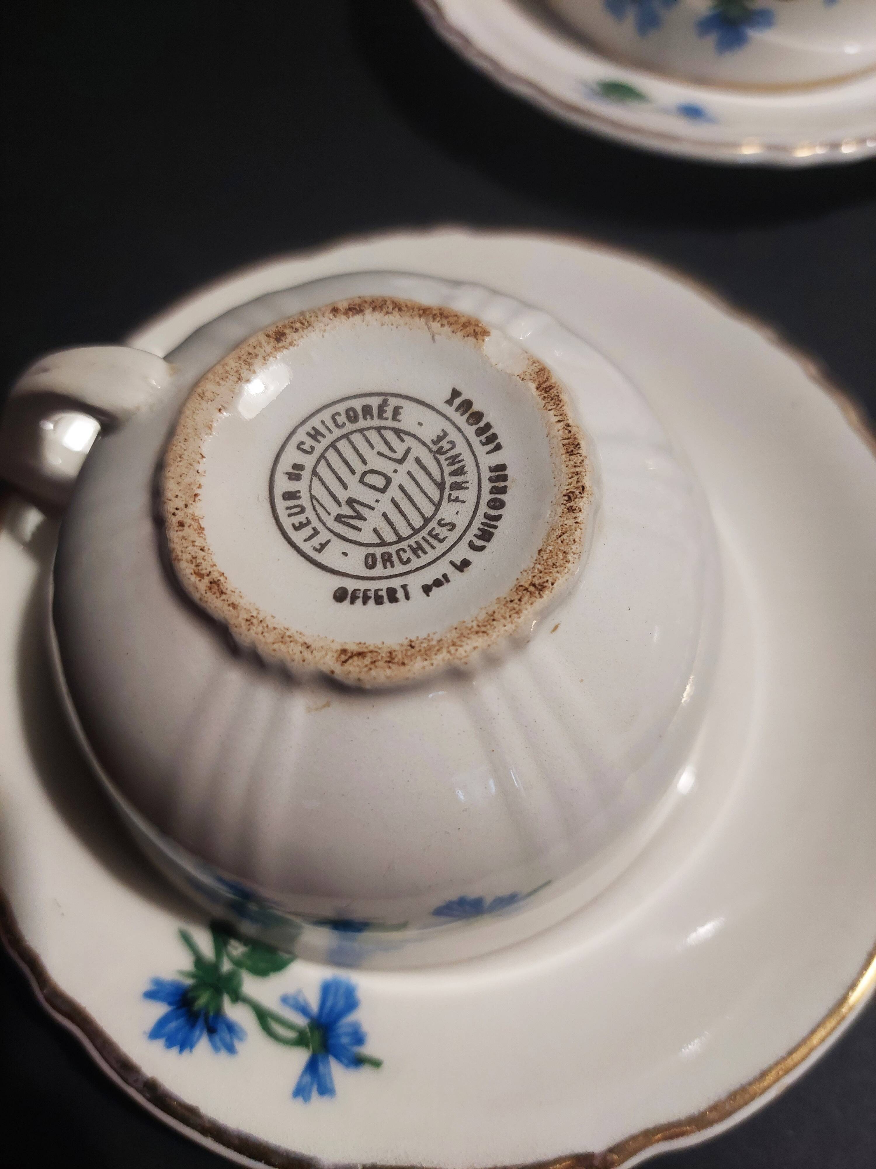 Series of four Orchies earthenware cups with chicory flower decoration