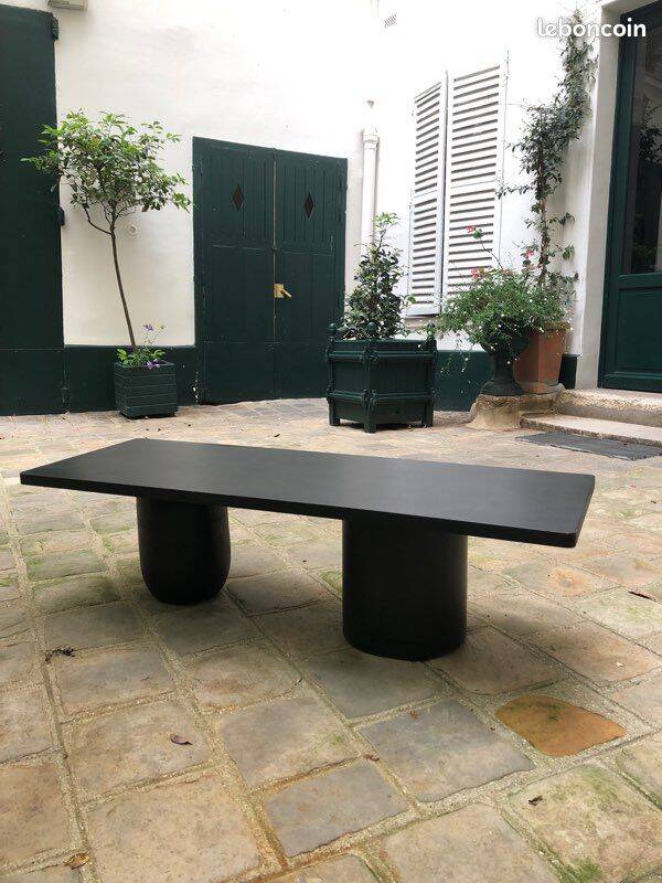 Rectangular coffee table in stained black wood with ball and cylindrical legs.