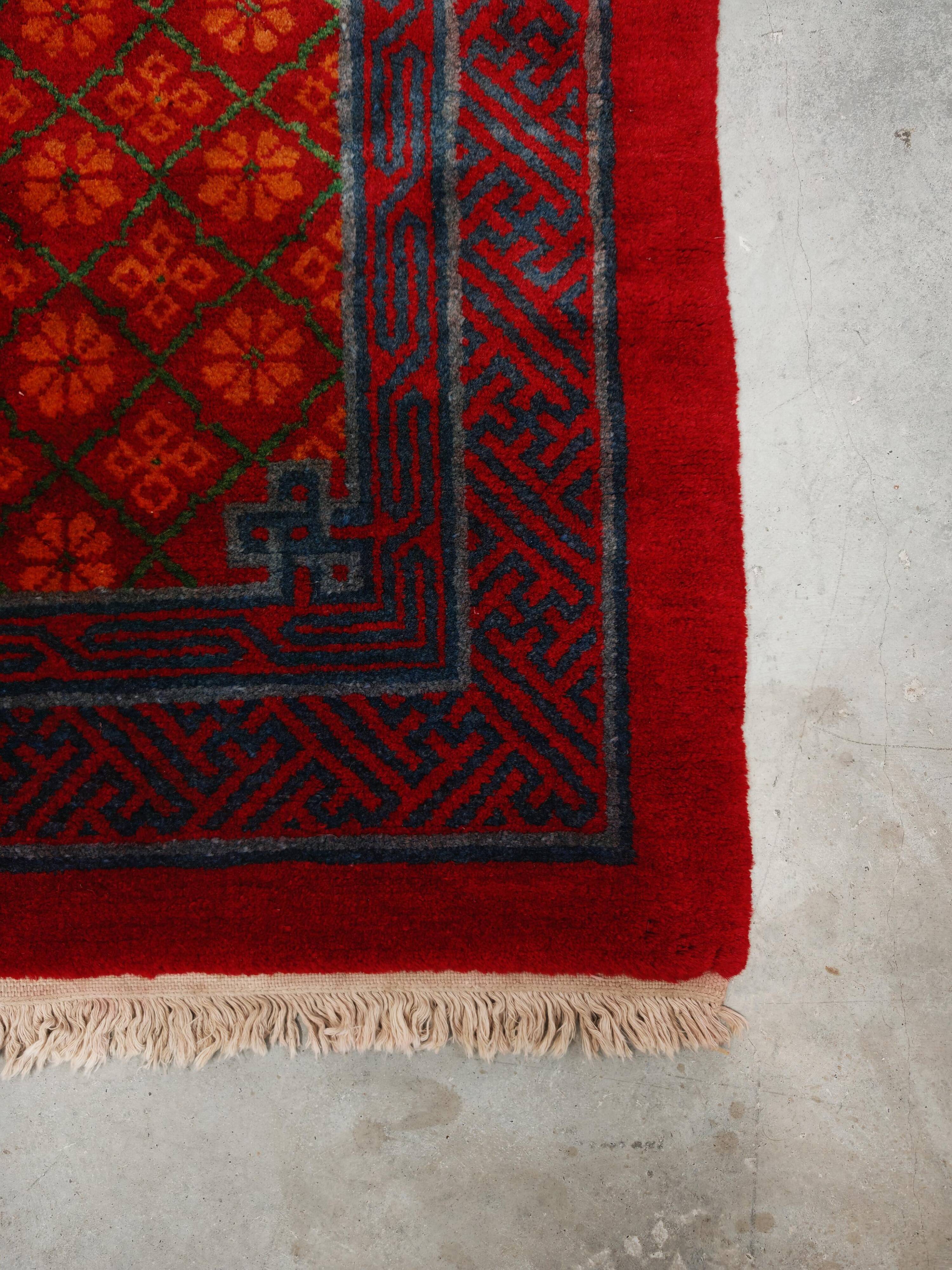 Ancient Khotan carpet, hand-knotted, floral pattern, Turkestan, 1960s.