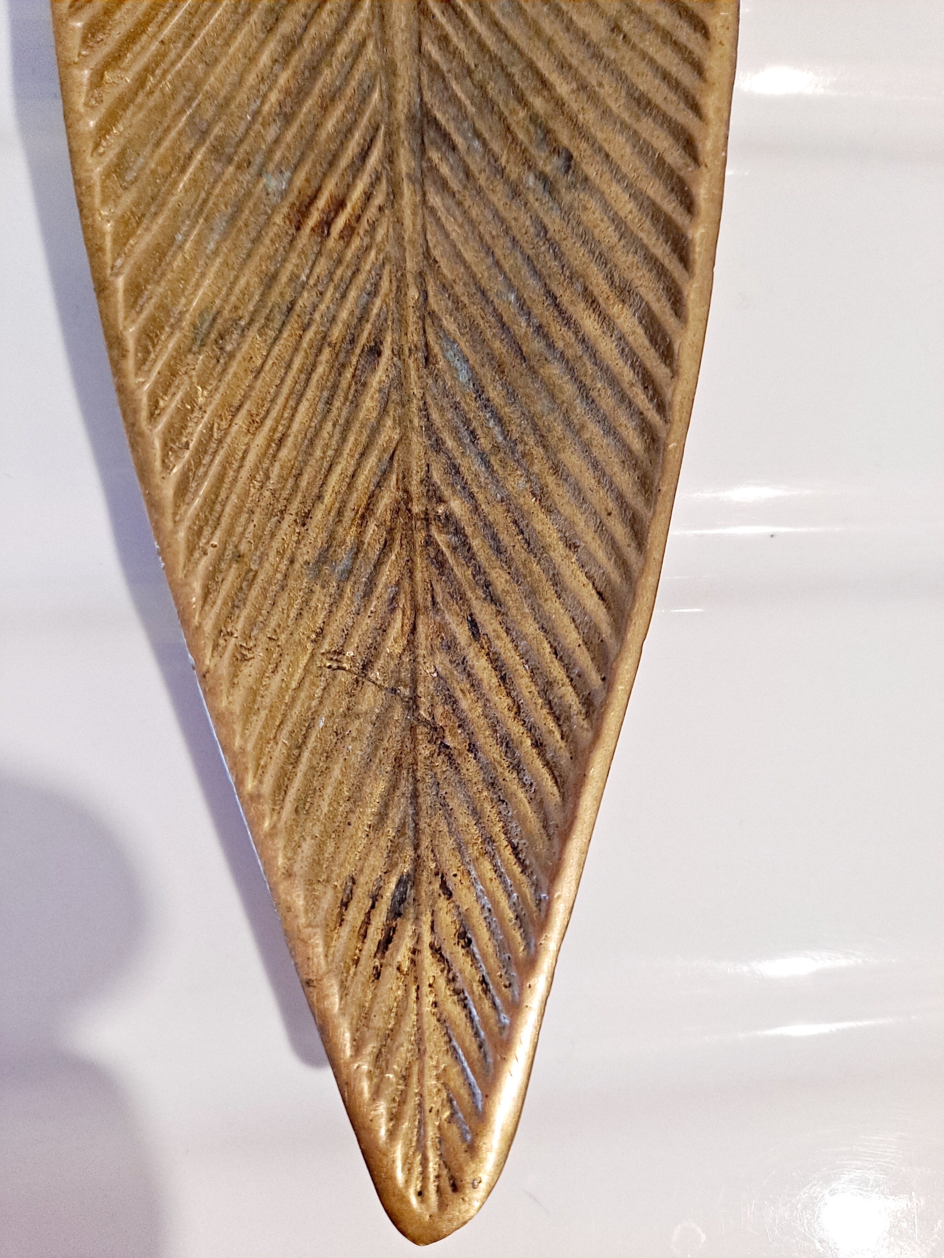 Empty brass leaf pocket