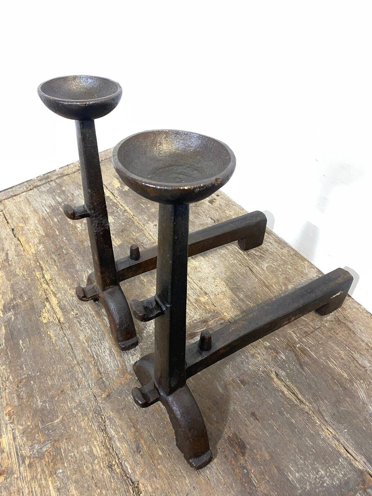 Pair of antique cast iron fire dogs, rustic decor, around 1900.
