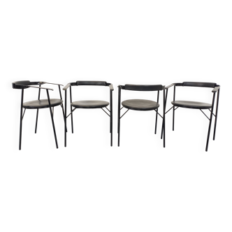 Suite de 4 chaises fauteuils vintage design italien en métal noir et skai