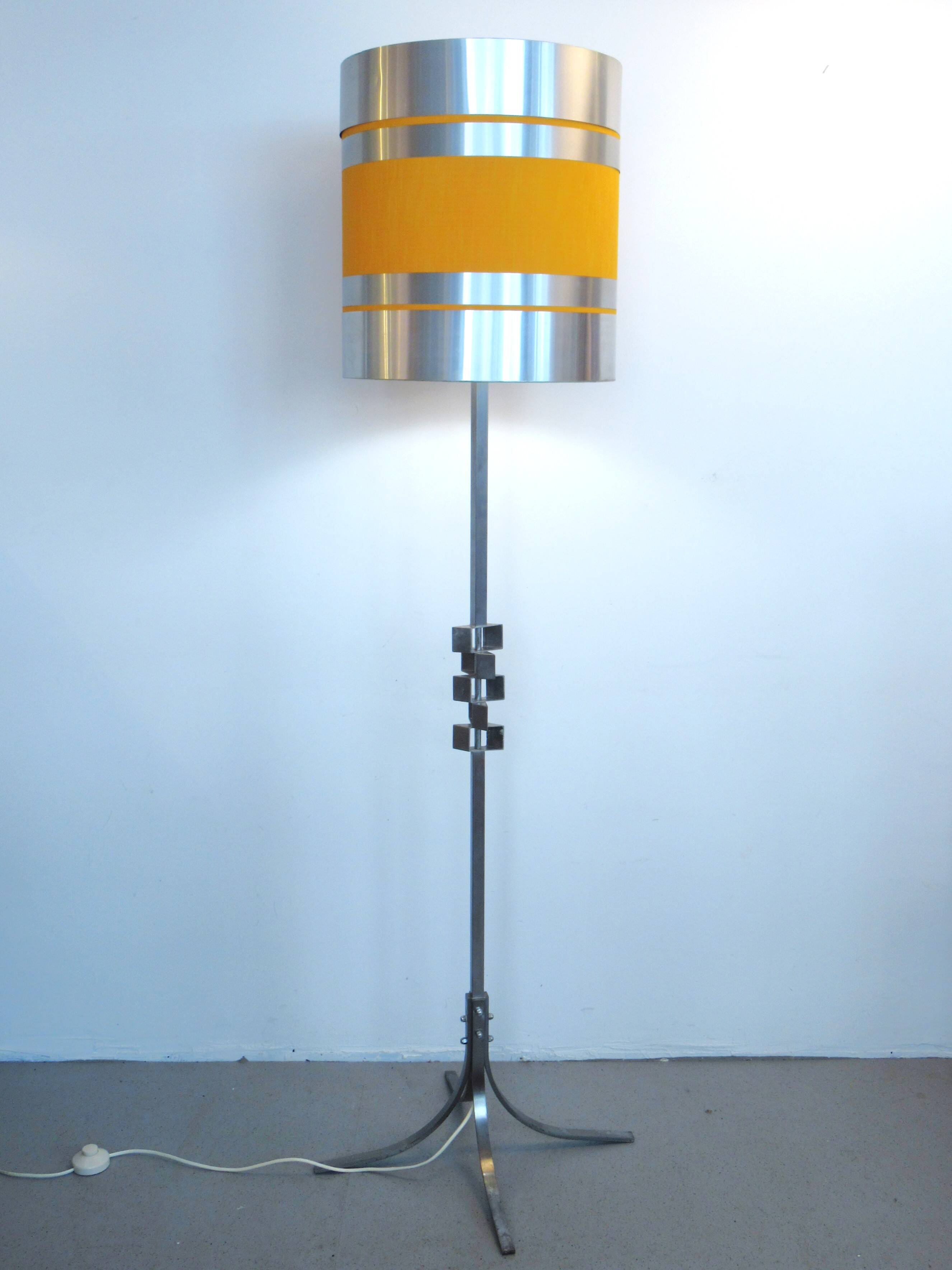 Floor lamp with a large orange shade and metal from the 1960s.