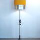 Floor lamp with a large orange shade and metal from the 1960s.