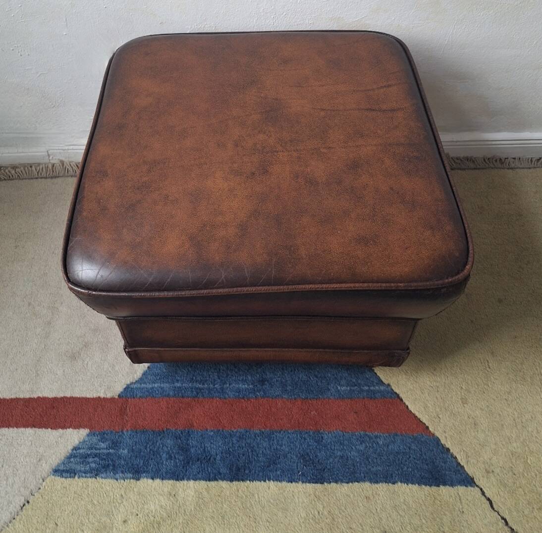 Vintage ottoman / pouffe in chestnut brown leather