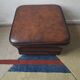 Vintage ottoman / pouffe in chestnut brown leather