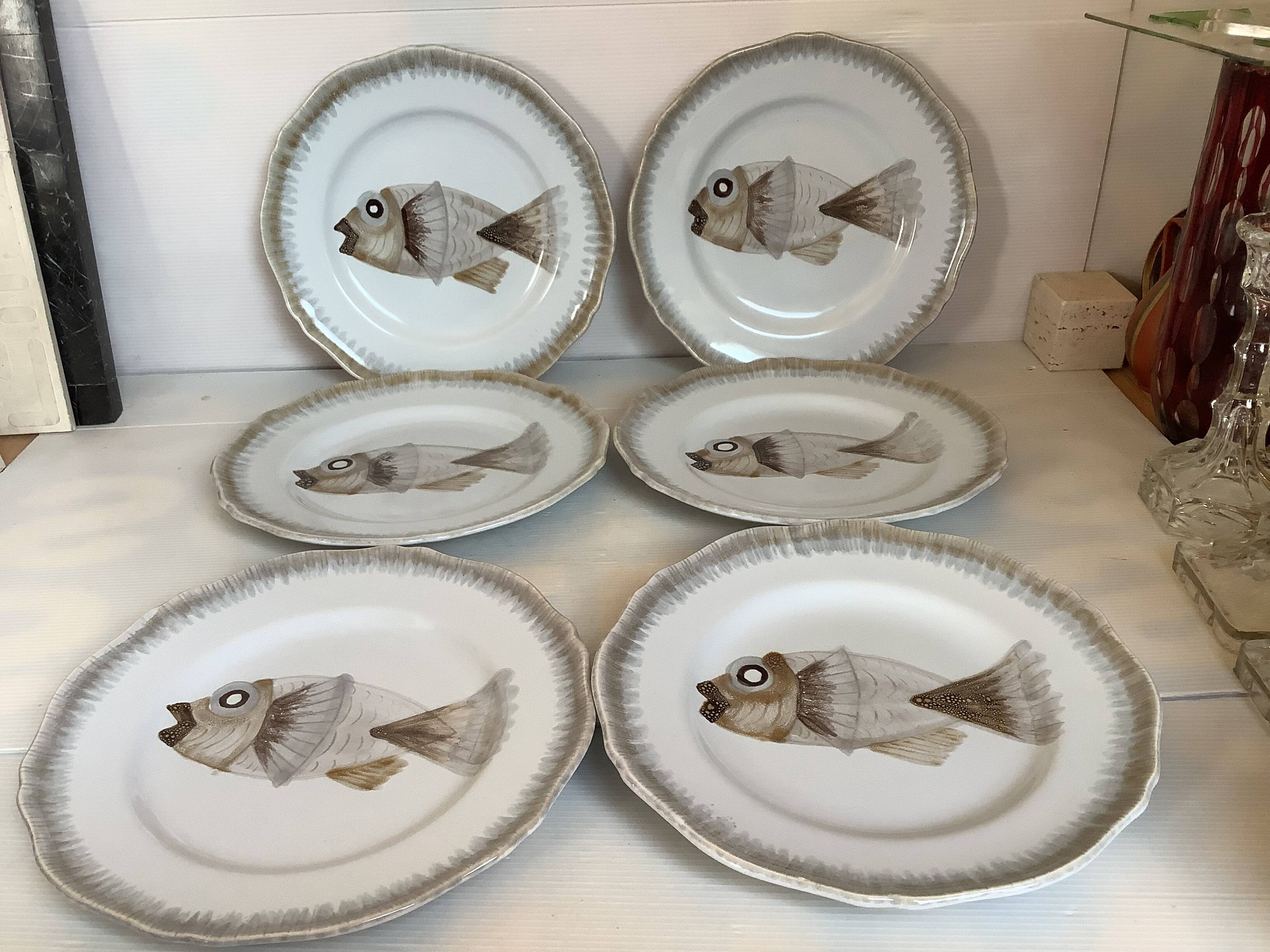 Six hand-decorated fish plates.