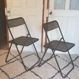 Pair of folding chairs in perforated metal