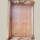 Small storage unit / freestanding shelf in light rattan.