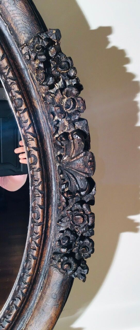 Oval mirror on an 18th century frame