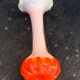 Orange and white opaline vase in the shape of a vintage flower corolla