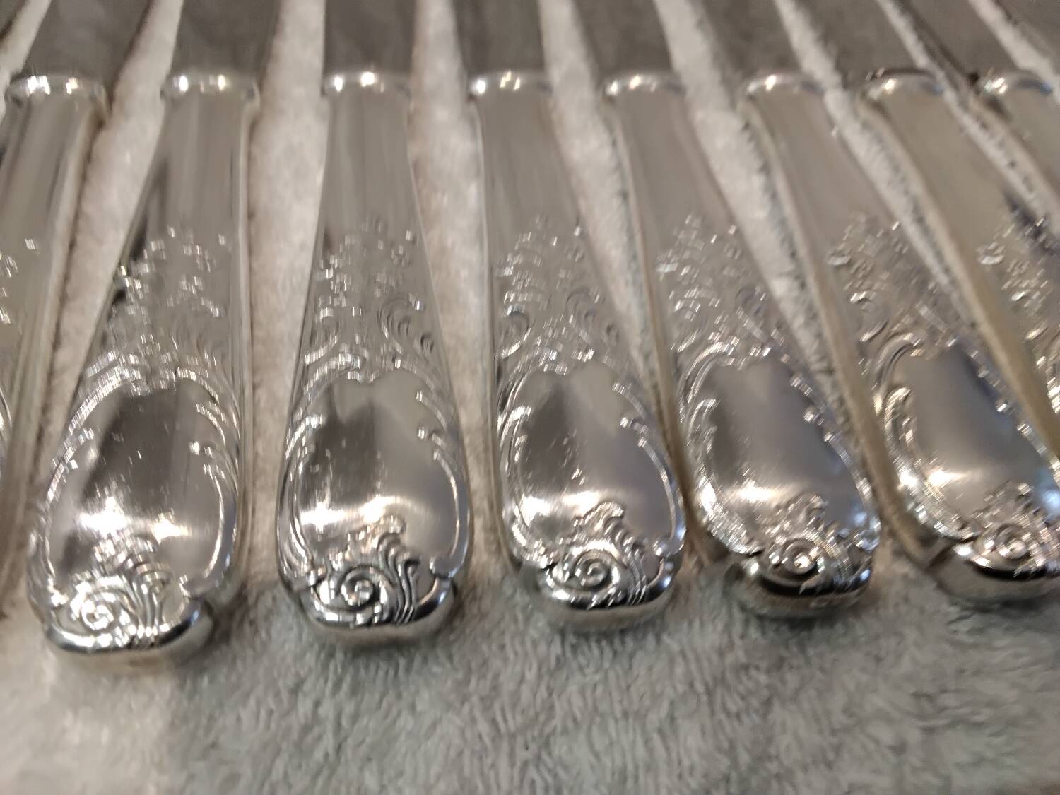 12 silver-plated dessert knives by Platil, rocaille style