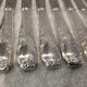 12 silver-plated dessert knives by Platil, rocaille style