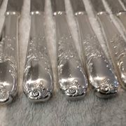 12 silver-plated dessert knives by Platil, rocaille style