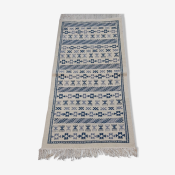 Handmade white and blue ethnic carpet