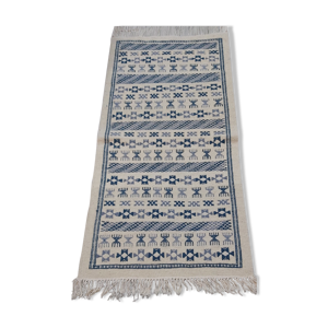 Tapis blanc et bleu ethnique fait