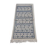 Handmade white and blue ethnic carpet
