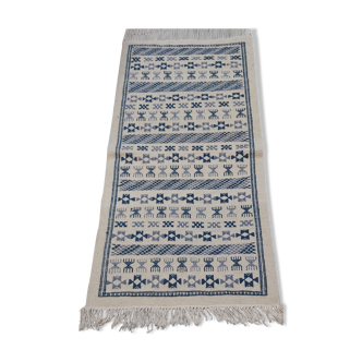 Handmade white and blue ethnic carpet