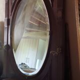 Coat rack with oval mirror