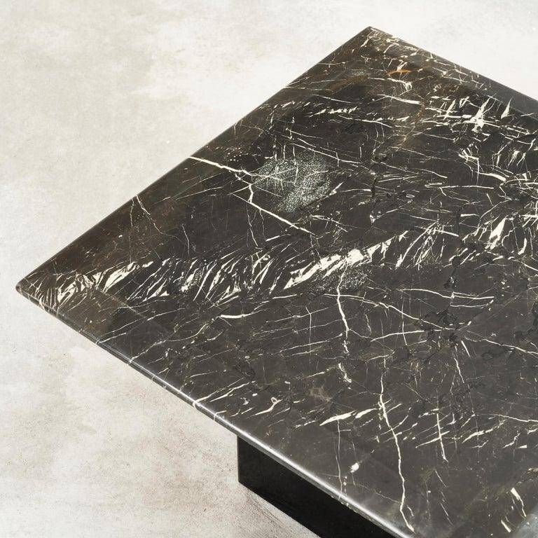 Set of 3 marble and lacquer coffee tables, 1970s.