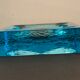Ashtray paved in blue glass