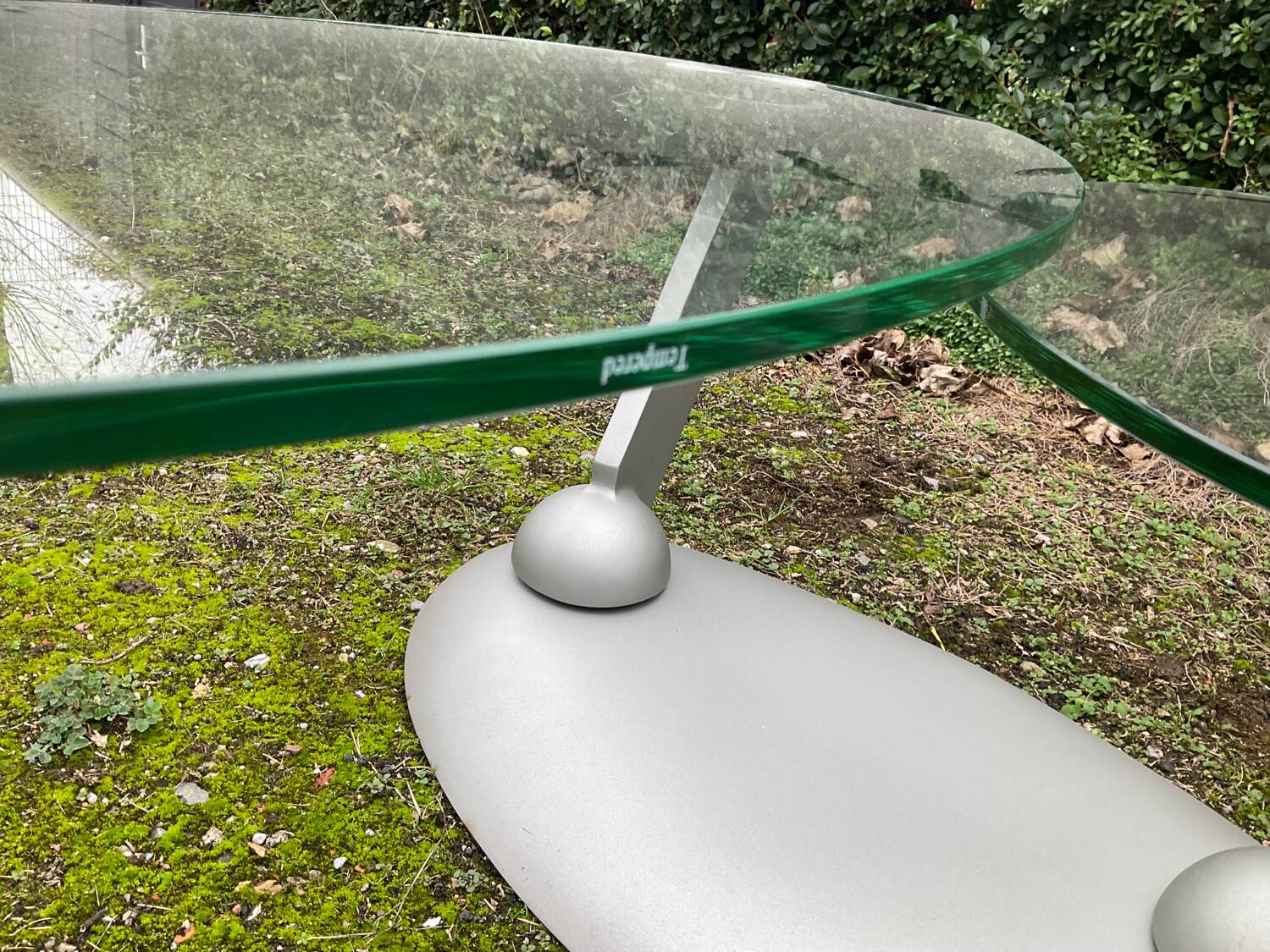 Naos designer coffee table in tempered glass and cast iron