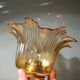 Amber tulip glass portable lamp, golden braided cord.