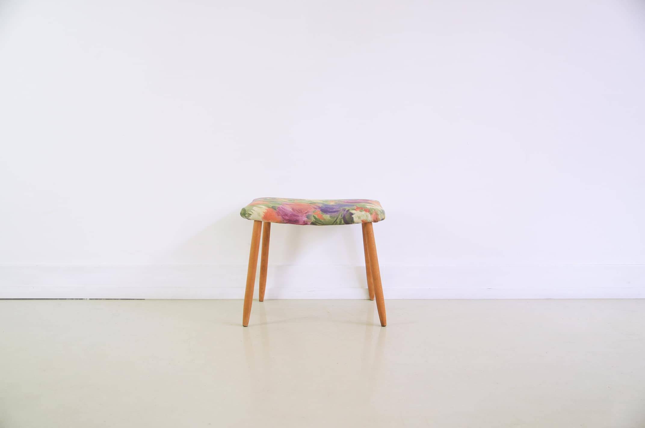 Footstool with flowered fabric
