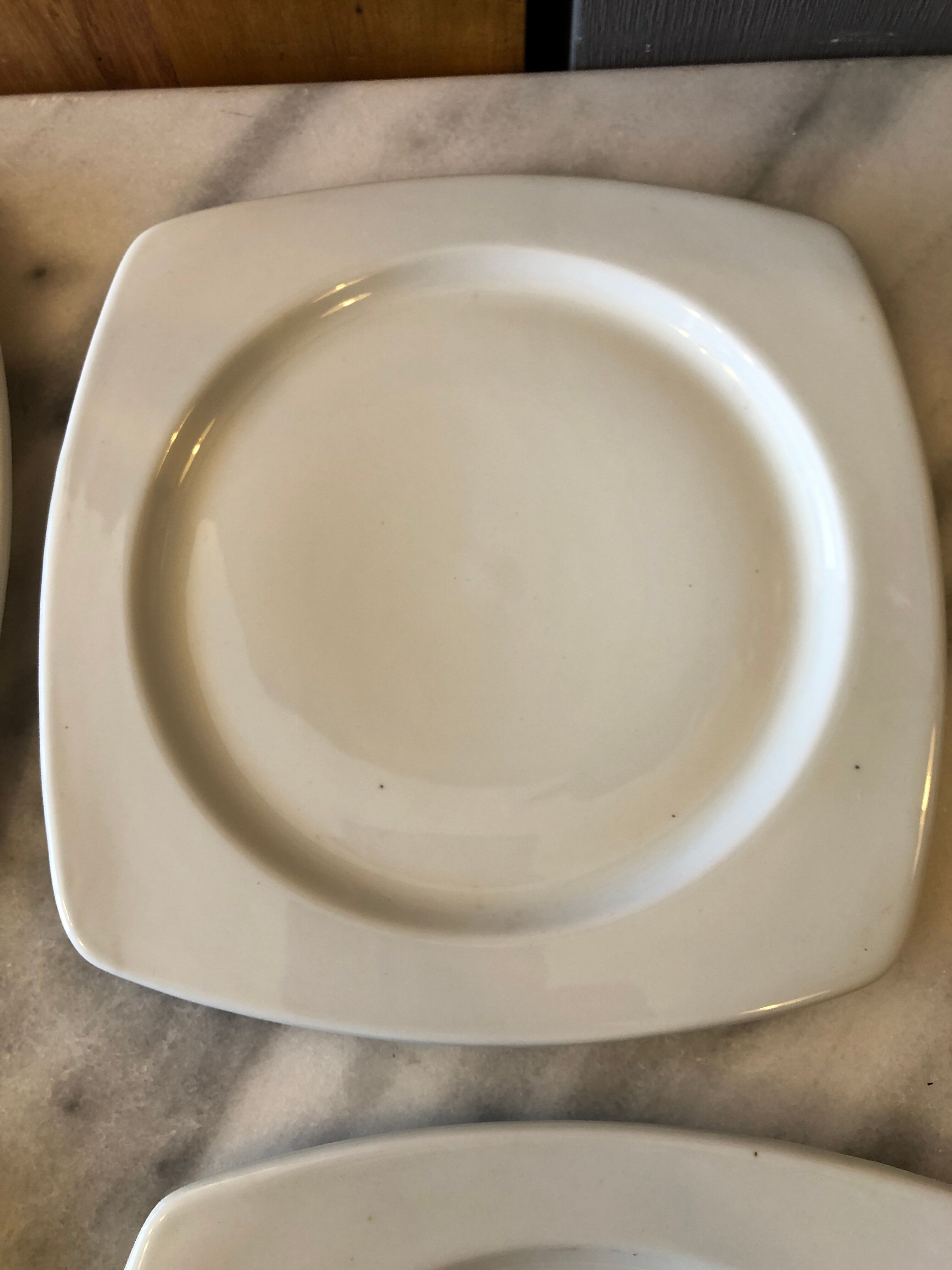 4 white porcelain plates