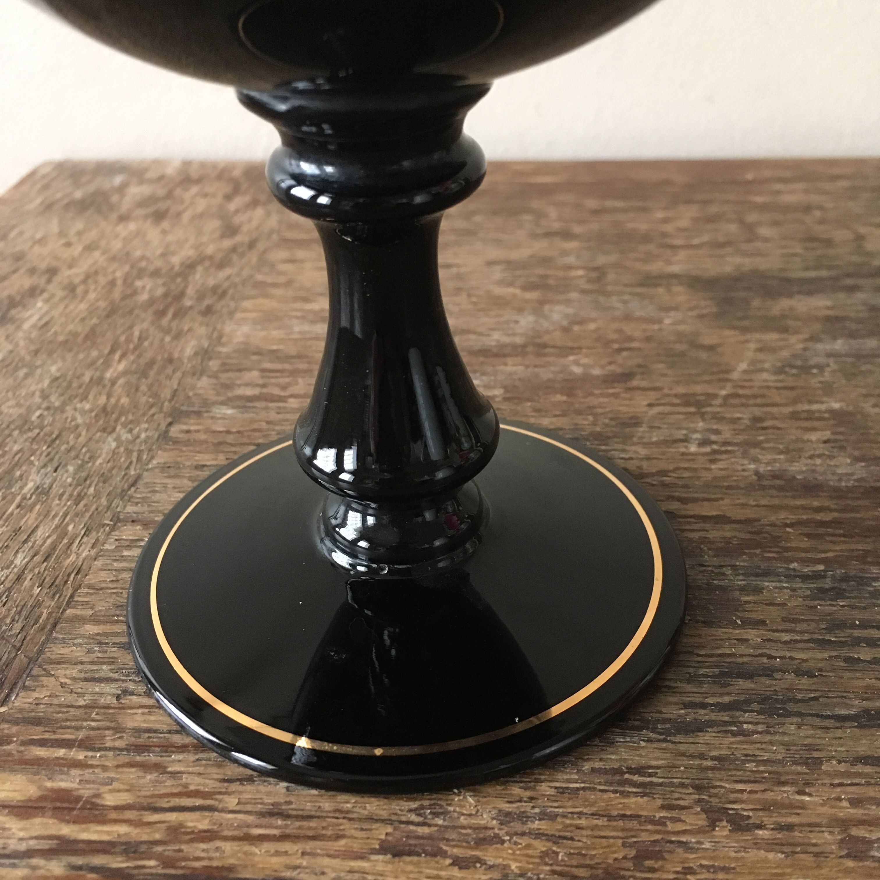 Large black vase with faience gold edging