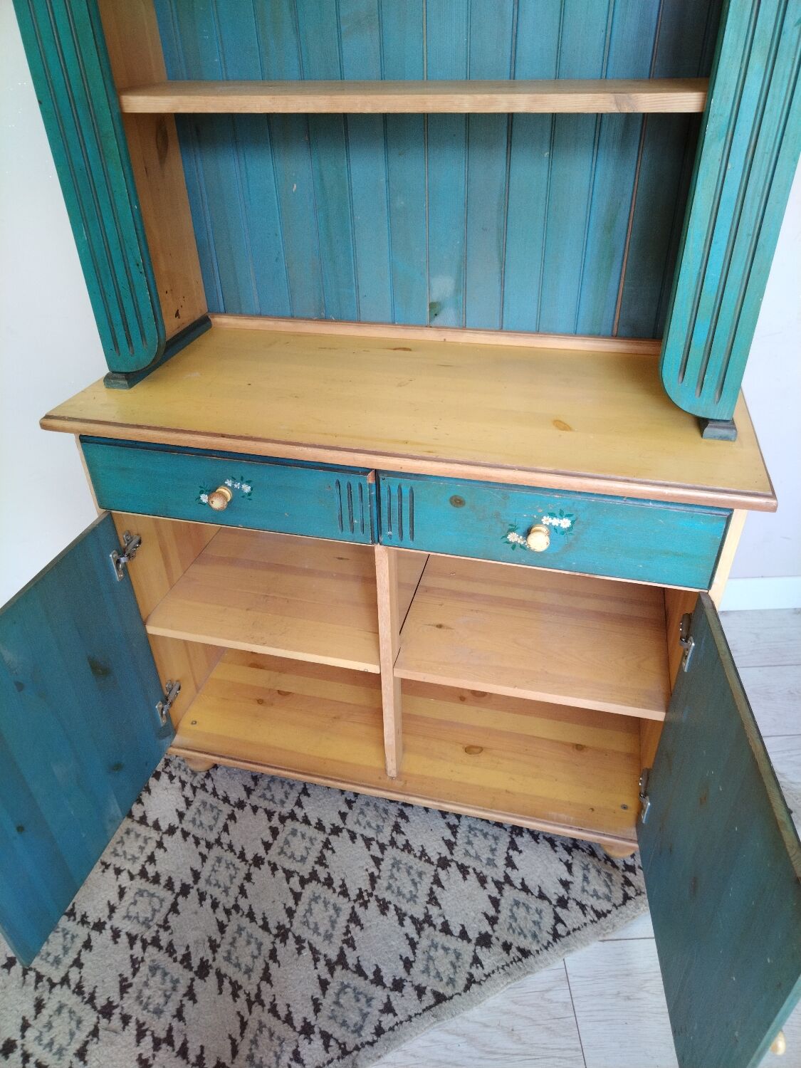 Rustic dresser with floral decor
