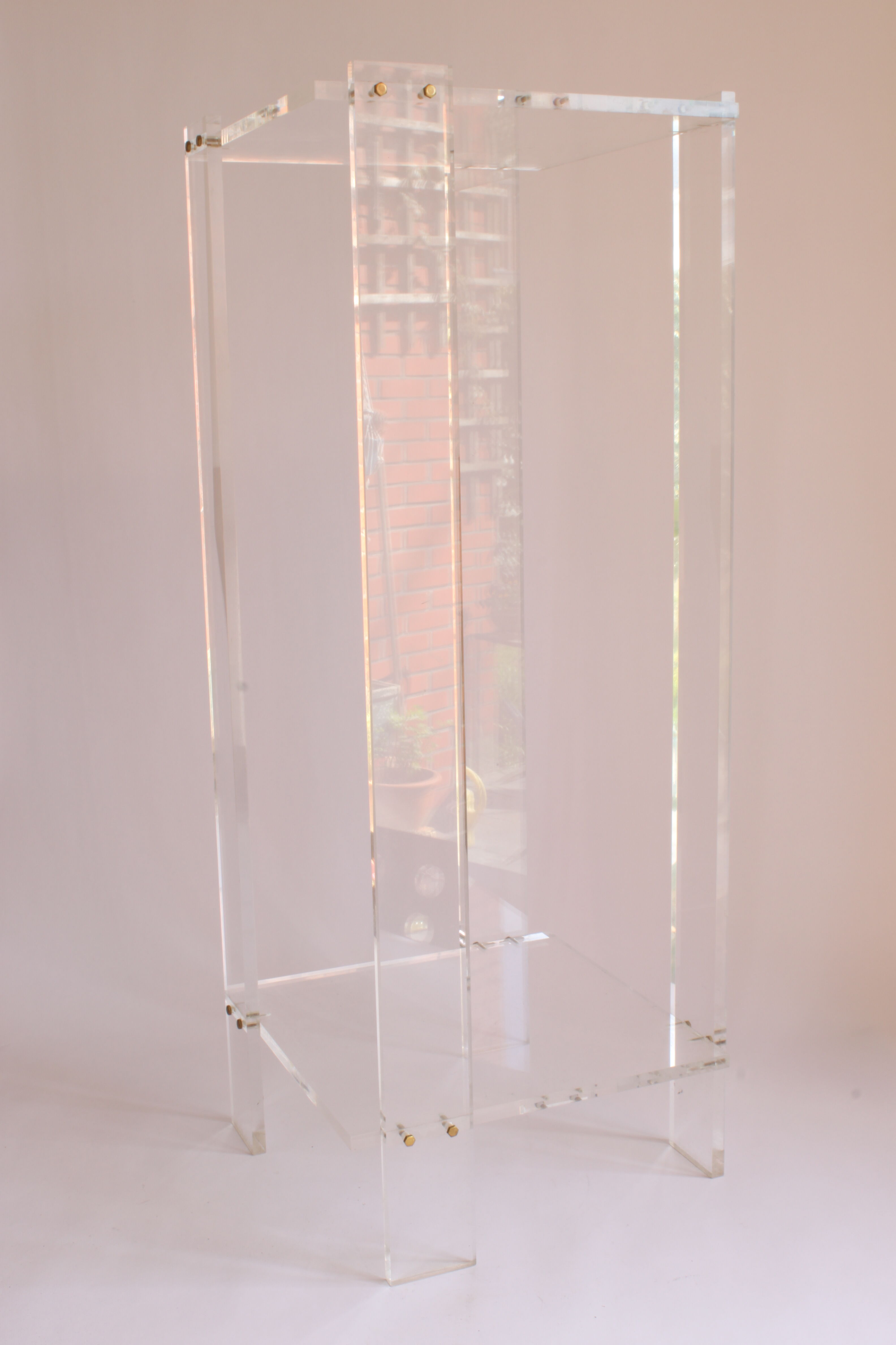 Tall lucite sidetable, 1970s.
