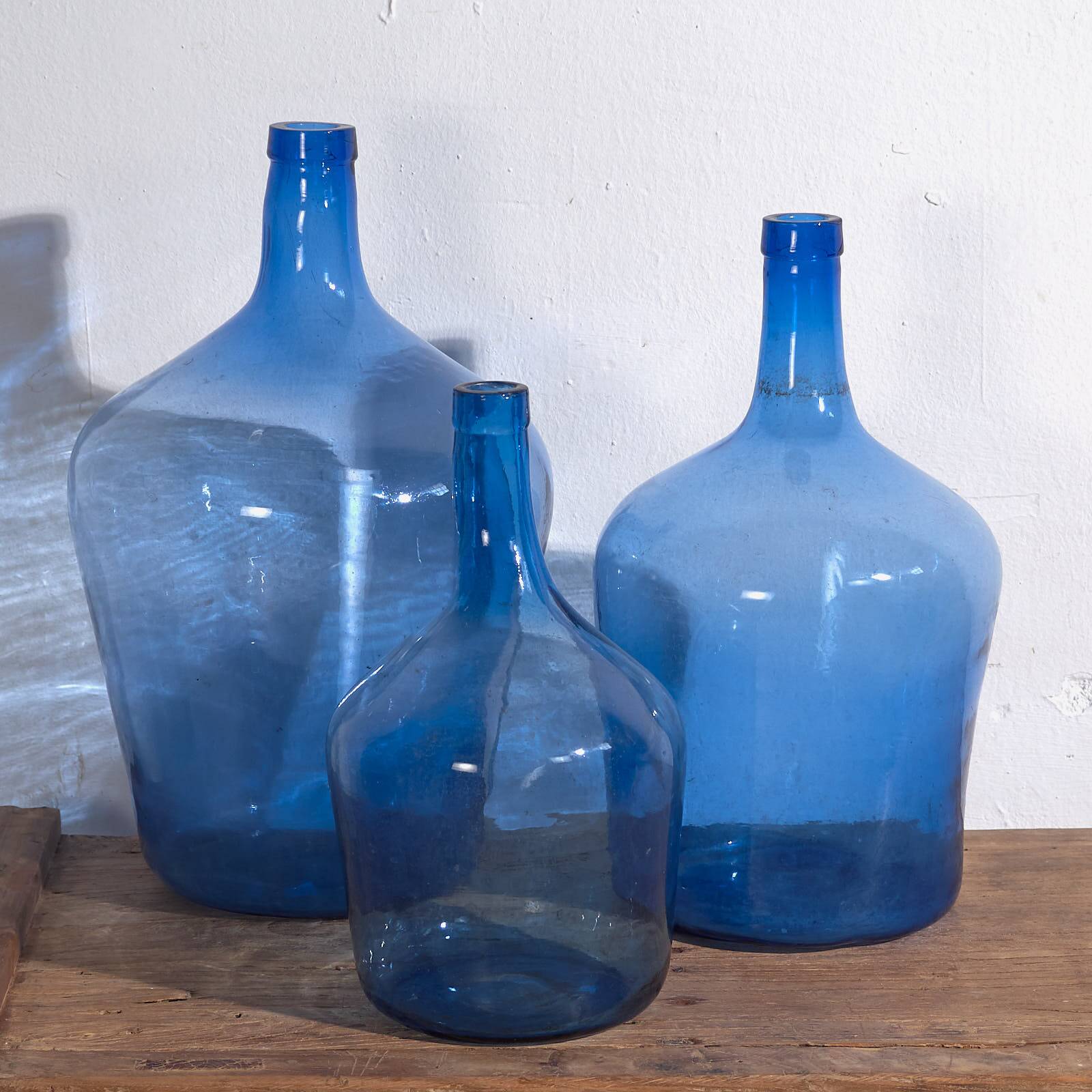 Antique blue demijohns (circa 1920). 3-piece set #1