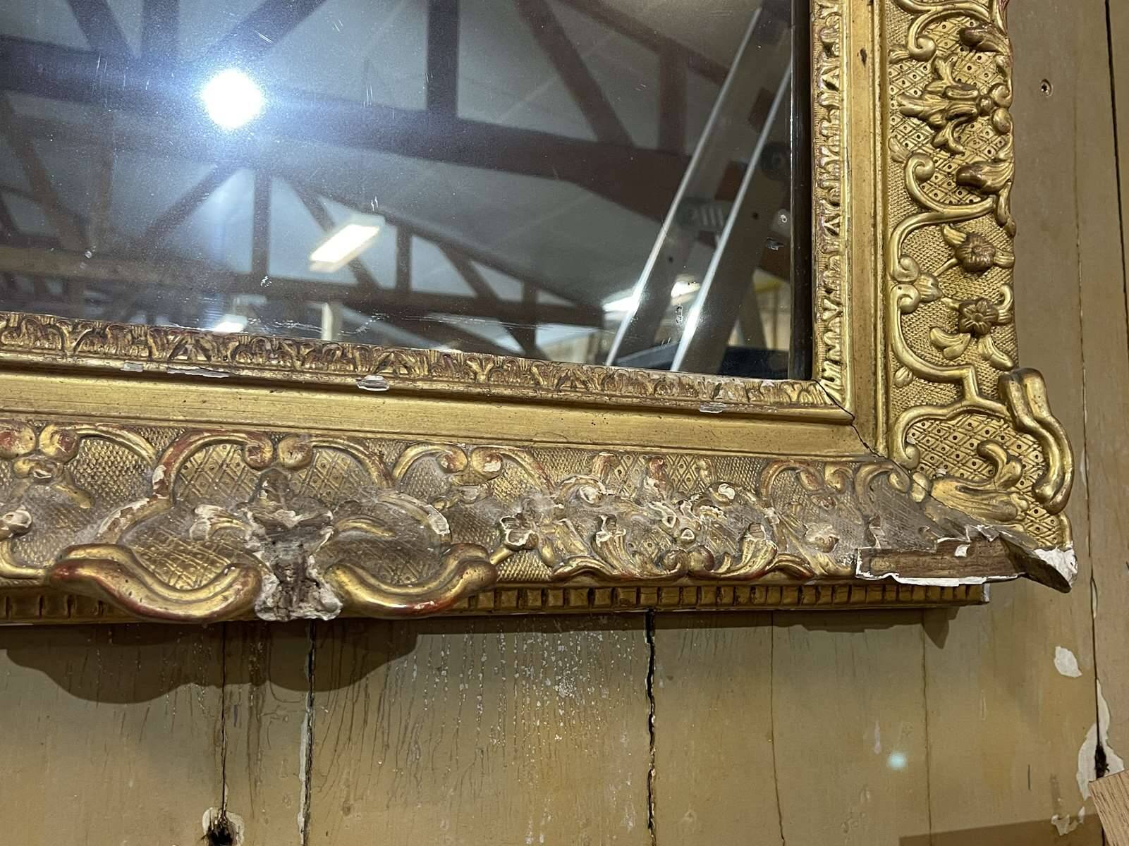 18th century Regency mirror in gilded wood