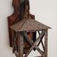 Wall lamp in wrought iron and old wood