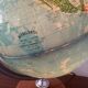 Bright vintage world map with wooden foot