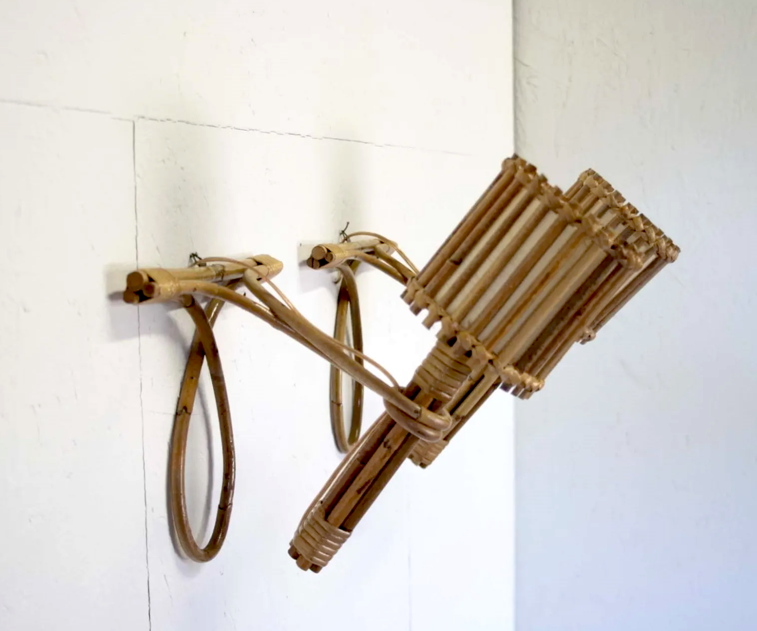 Pair of Louis Sognot rattan sconces