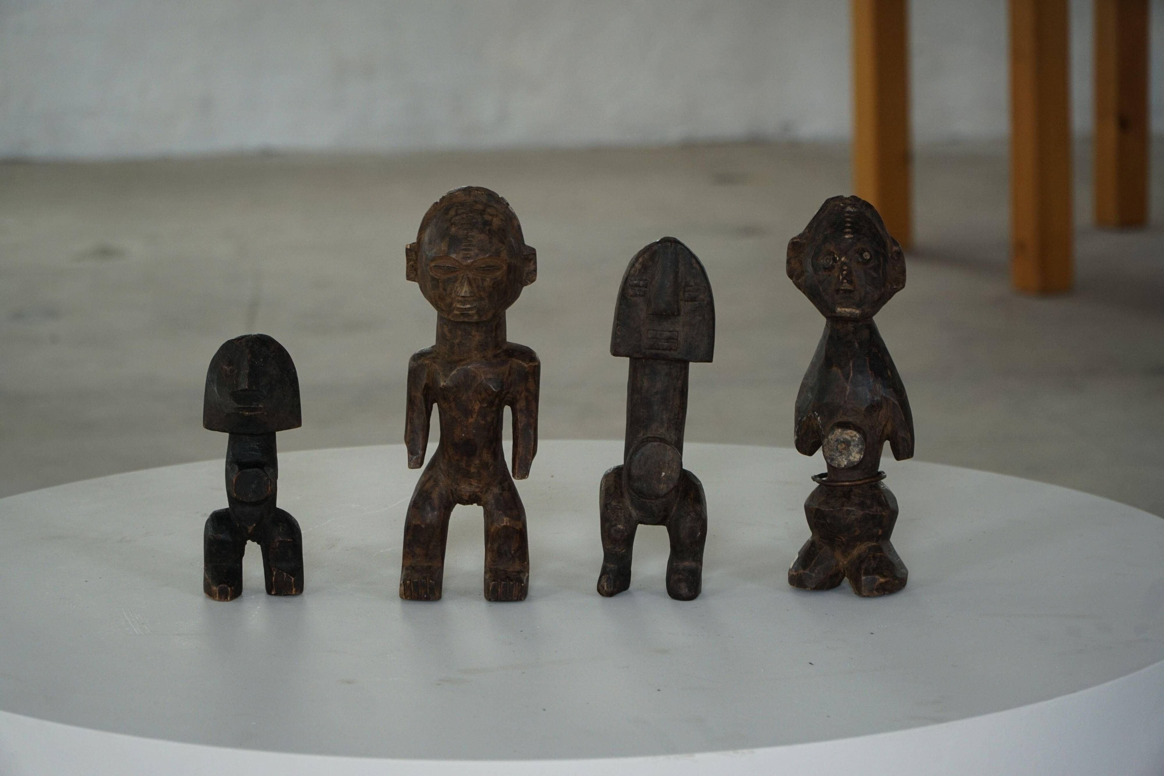 Set of 4 decorative handcrafted African wooden sculptures, mid-century.