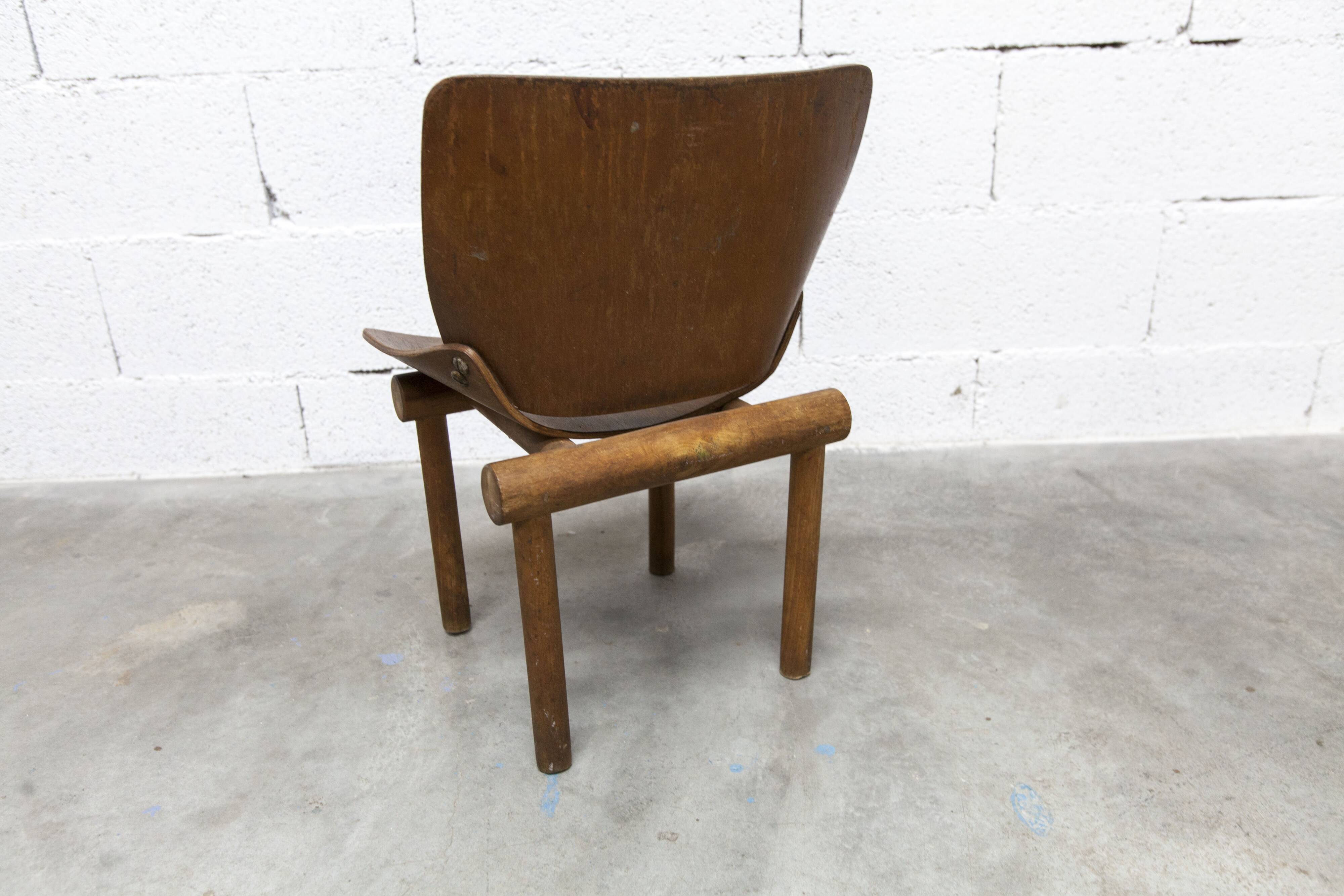 Atypical 1960s curved wood children's chair