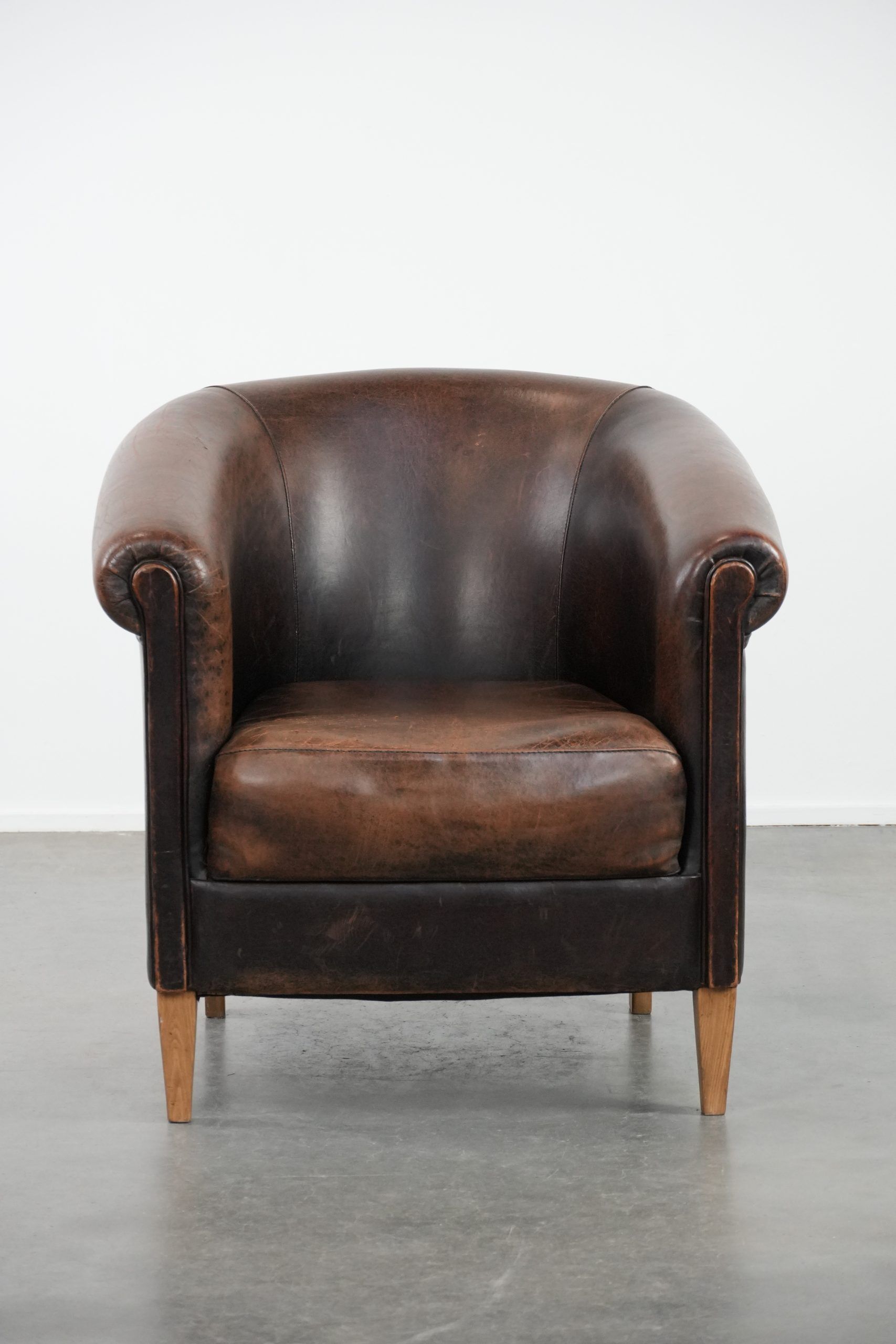 Characterful club armchair made of sheepskin with a beautiful patina