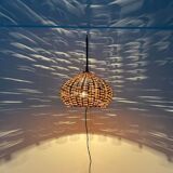 Mid-century modern Danish extendable cantilever wall lamp with a rattan shade, 1960s.