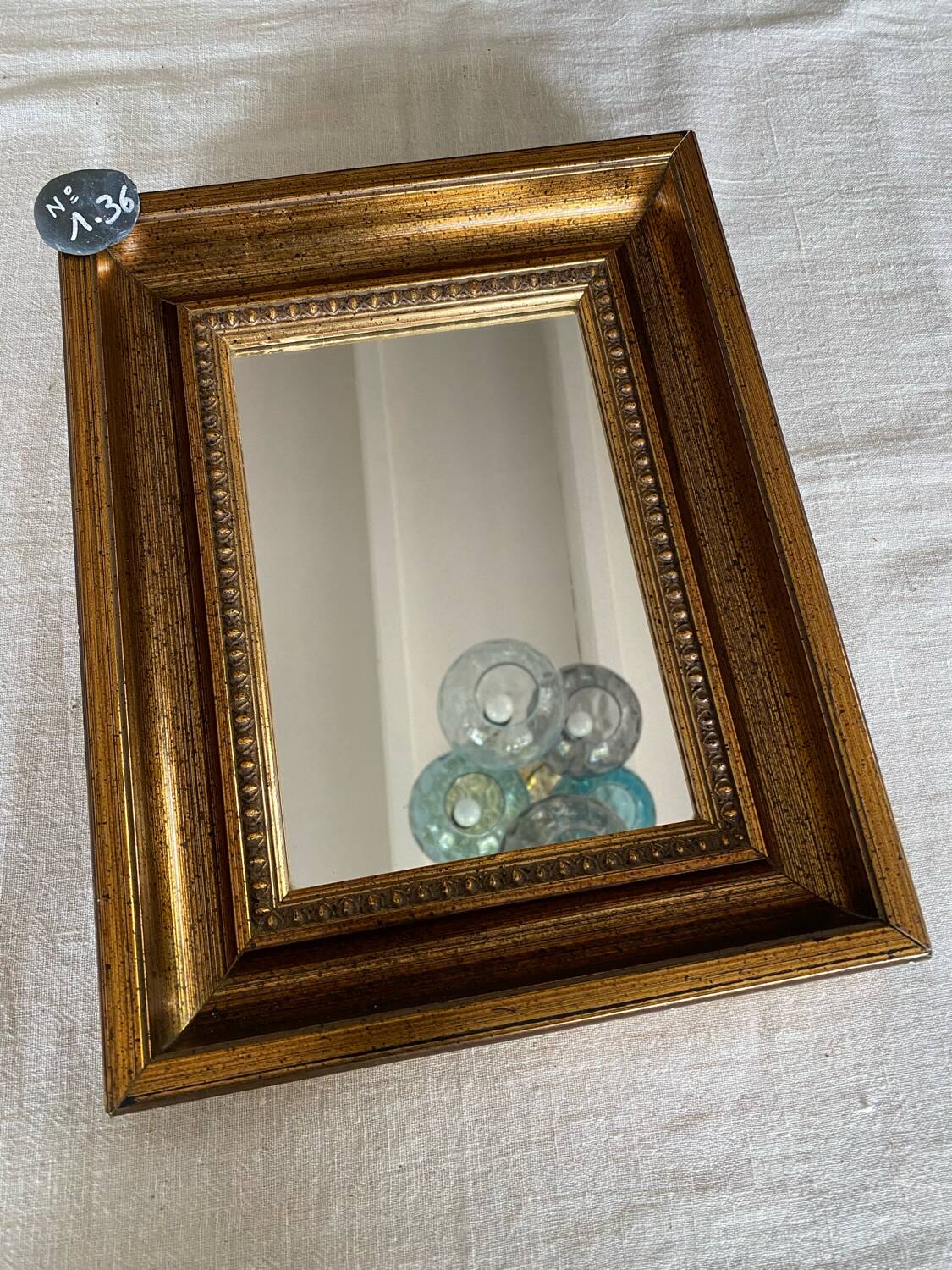 Bronze-colored framed mirror