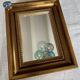 Bronze-colored framed mirror