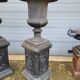 Large antique cast iron vases on pedestal